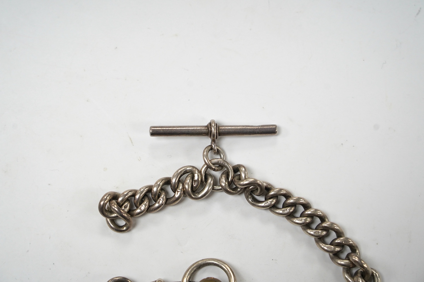 A late Victorian silver open face pocket watch, by J.W. Benson, with Roman dial and subsidiary seconds, together with a silver albert. Condition - poor to fair